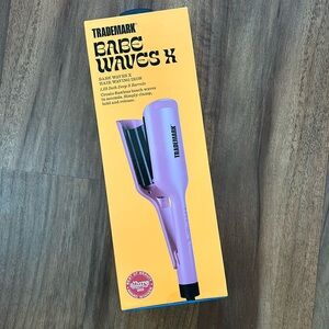 Never opened - still in box. Trademark babe waves X in pink